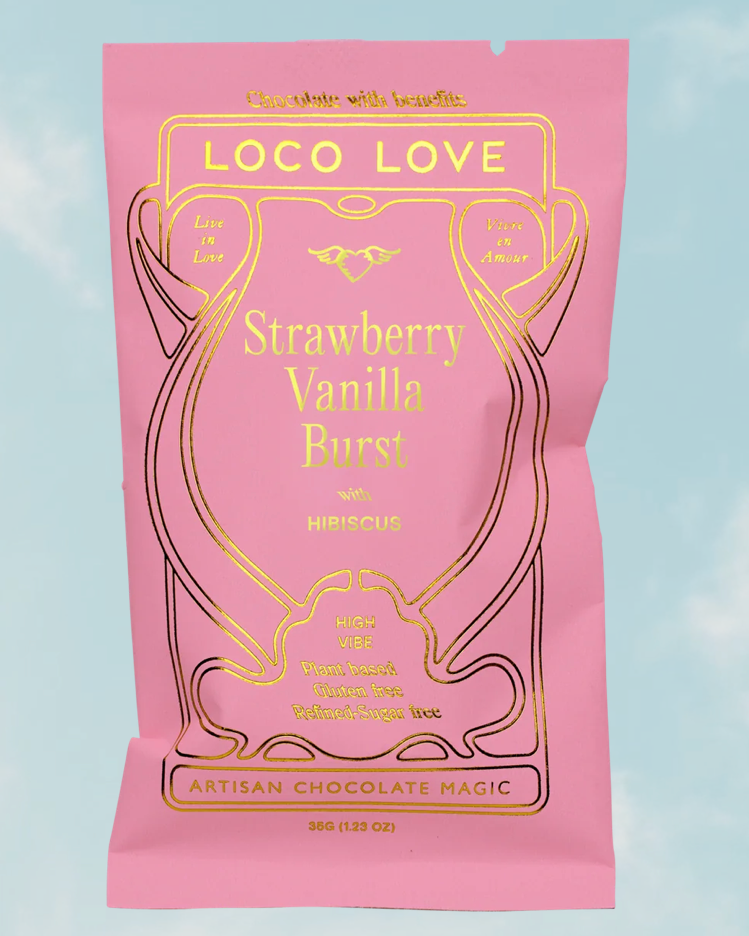 Pink packaging of Loco Love Strawberry Vanilla Burst with Hibiscus on a light blue background