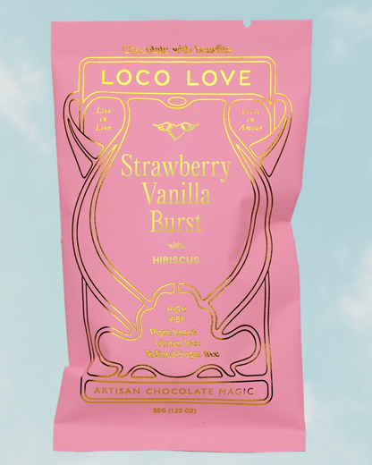 Pink packaging of Loco Love Strawberry Vanilla Burst with Hibiscus on a light blue background