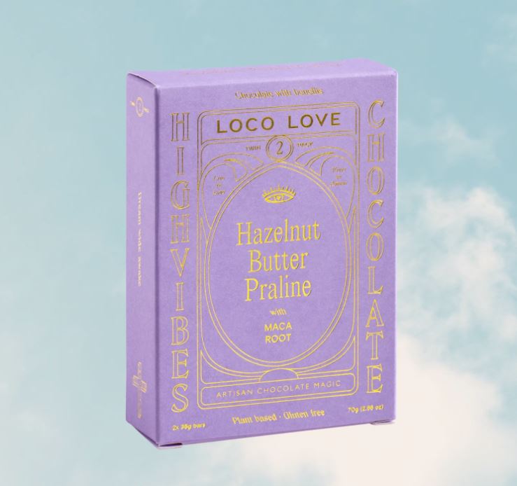 Purple packaging of Loco Love High Vibes Chocolate with gold text on a light blue background
