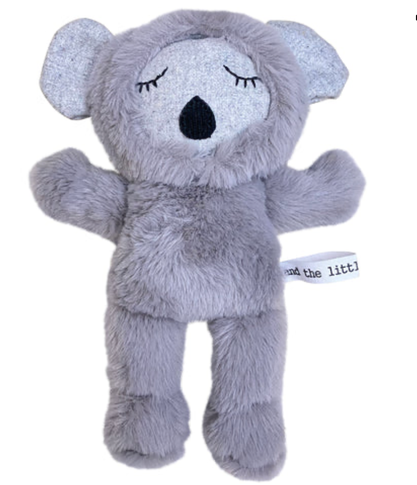 Gray plush koala toy with closed eyes on a white background