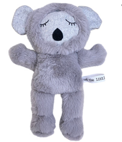 Gray plush koala toy with closed eyes on a white background