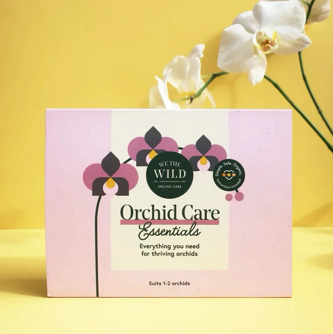 Orchid Care Essentials packaging with orchids on a yellow background